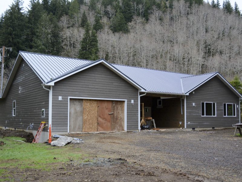 Vandecoevering home with siding, roof, doors, and windows